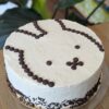 Vanilla cake with vanilla cream and chocolate mousse filling with a topping of Nijntje