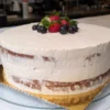 image of a vanilla cake with vanilla cream and berries on top